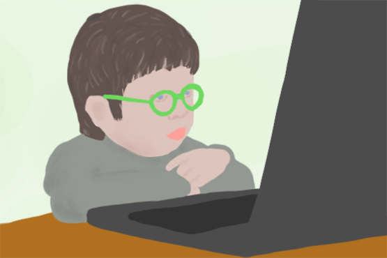 Ребенок в очках за ноутбуком